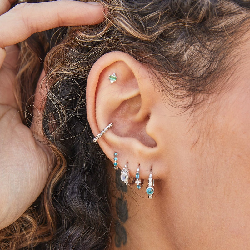 solid gold earring stack including the Tsavorite & Diamond Star Flat Back Earring 14k White Gold