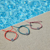 chakra bracelets by the pool including the Heart Chakra Bracelet sterling silver