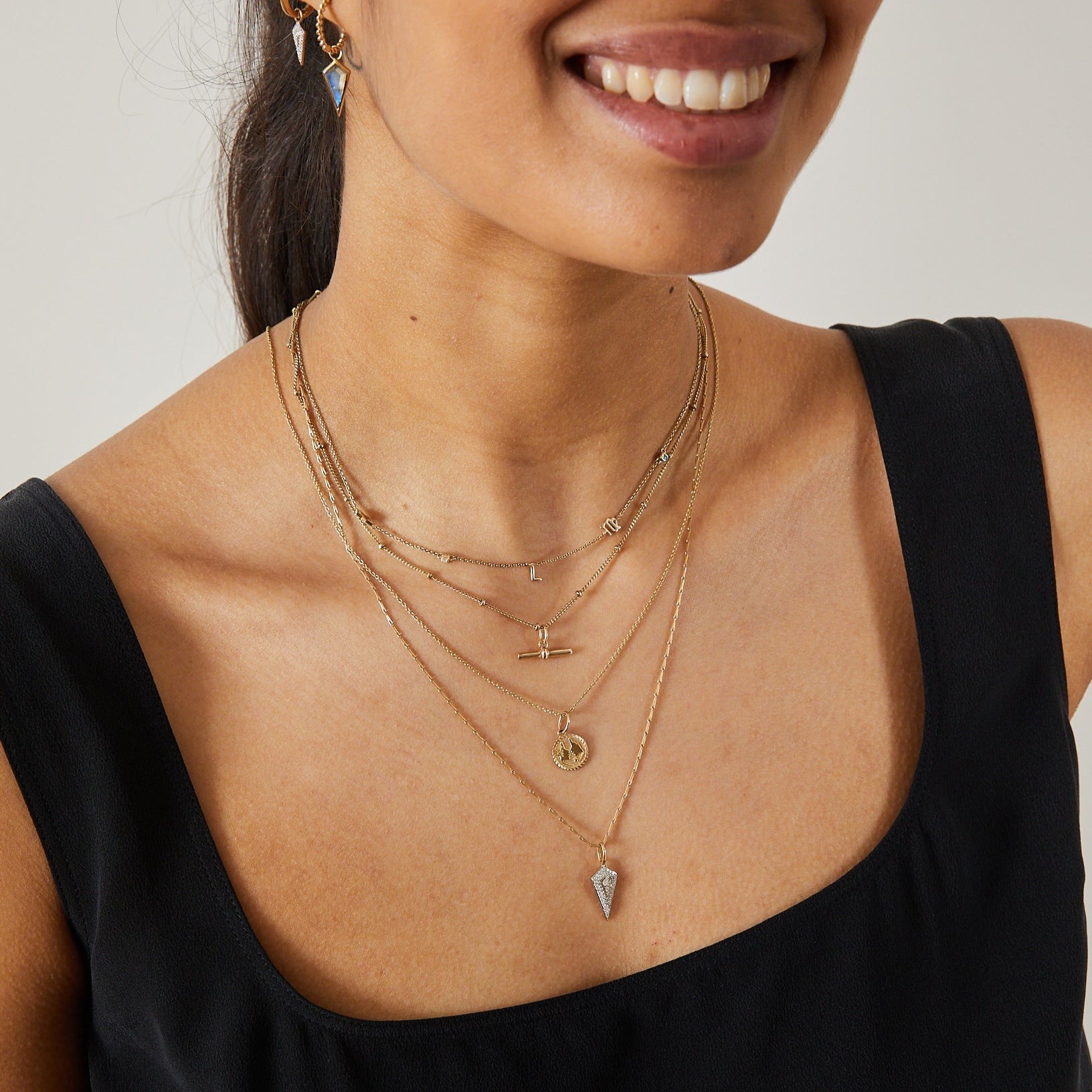 model showing layered necklaces including the Diamond Rhombus Pendant  9k Gold