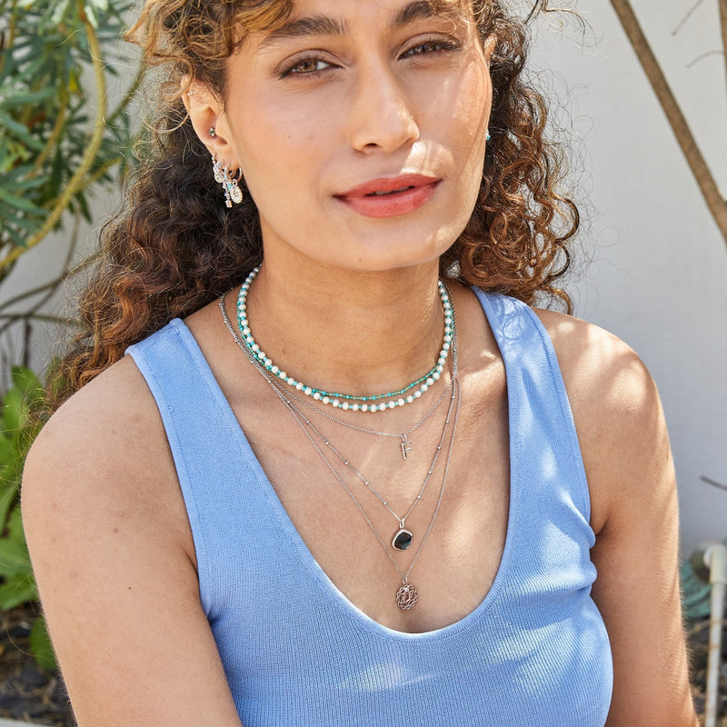 model wearing sterling silver jewellery including the Pearl & Turquoise Necklace Sterling Silver