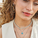 model wearing silver necklaces including the Pearl & Turquoise Necklace Sterling Silver