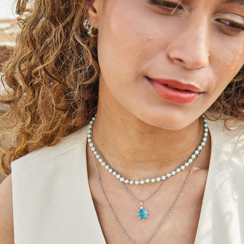 model wearing silver necklaces including the Pearl & Turquoise Necklace Sterling Silver