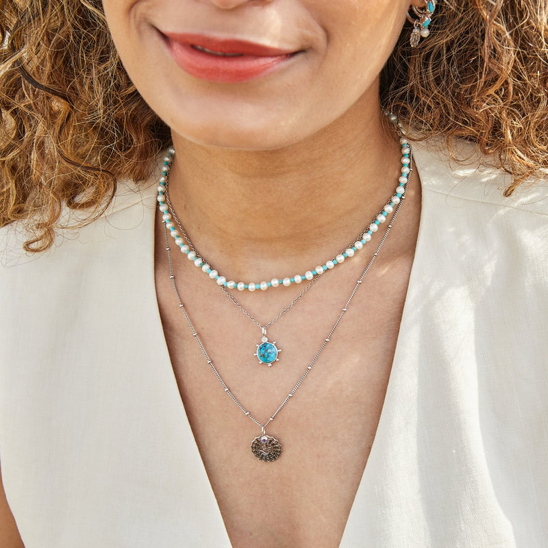 model wearing layered necklaces including the Pearl & Turquoise Necklace Sterling Silver