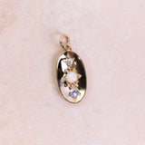 Personalised Domed Pendant 9k Gold on hard surface