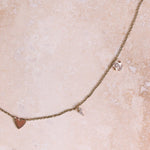 Personalised Necklace 9k Gold with charms on hard surface