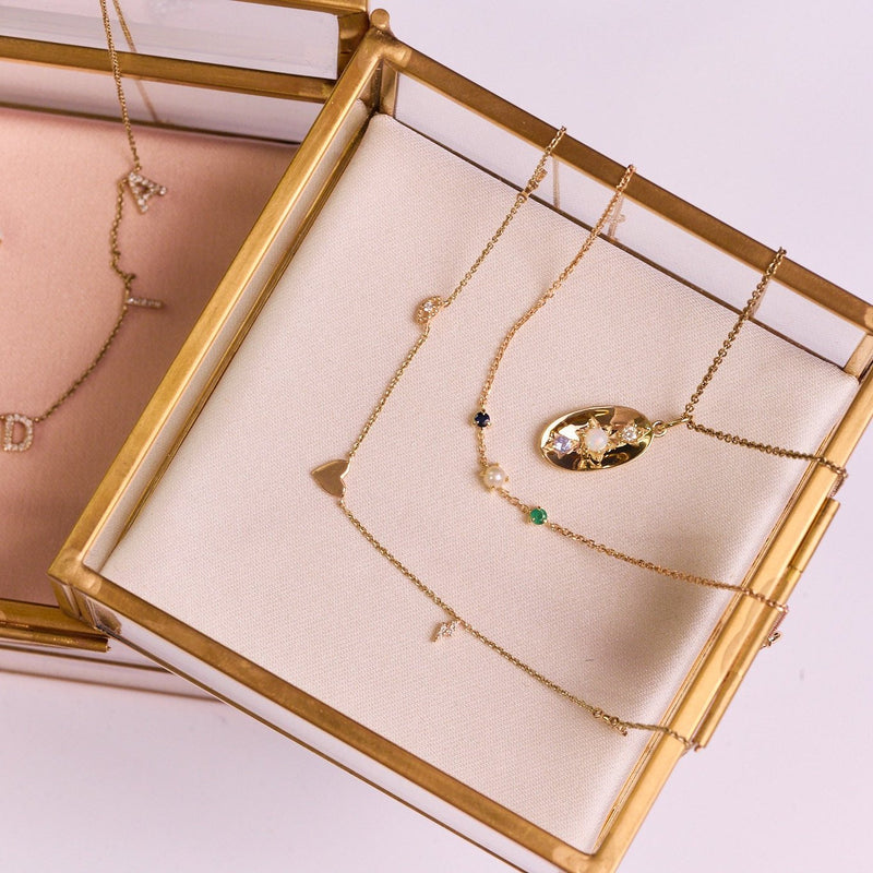 solid gold necklaces in jewellery box including the Personalised Domed Pendant 9k Gold