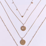 Personalised Initial Necklace 9k Gold  displayed along with other solid gold necklaces