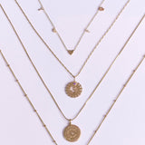 Personalised Initial Necklace 9k Gold  displayed along with other solid gold necklaces