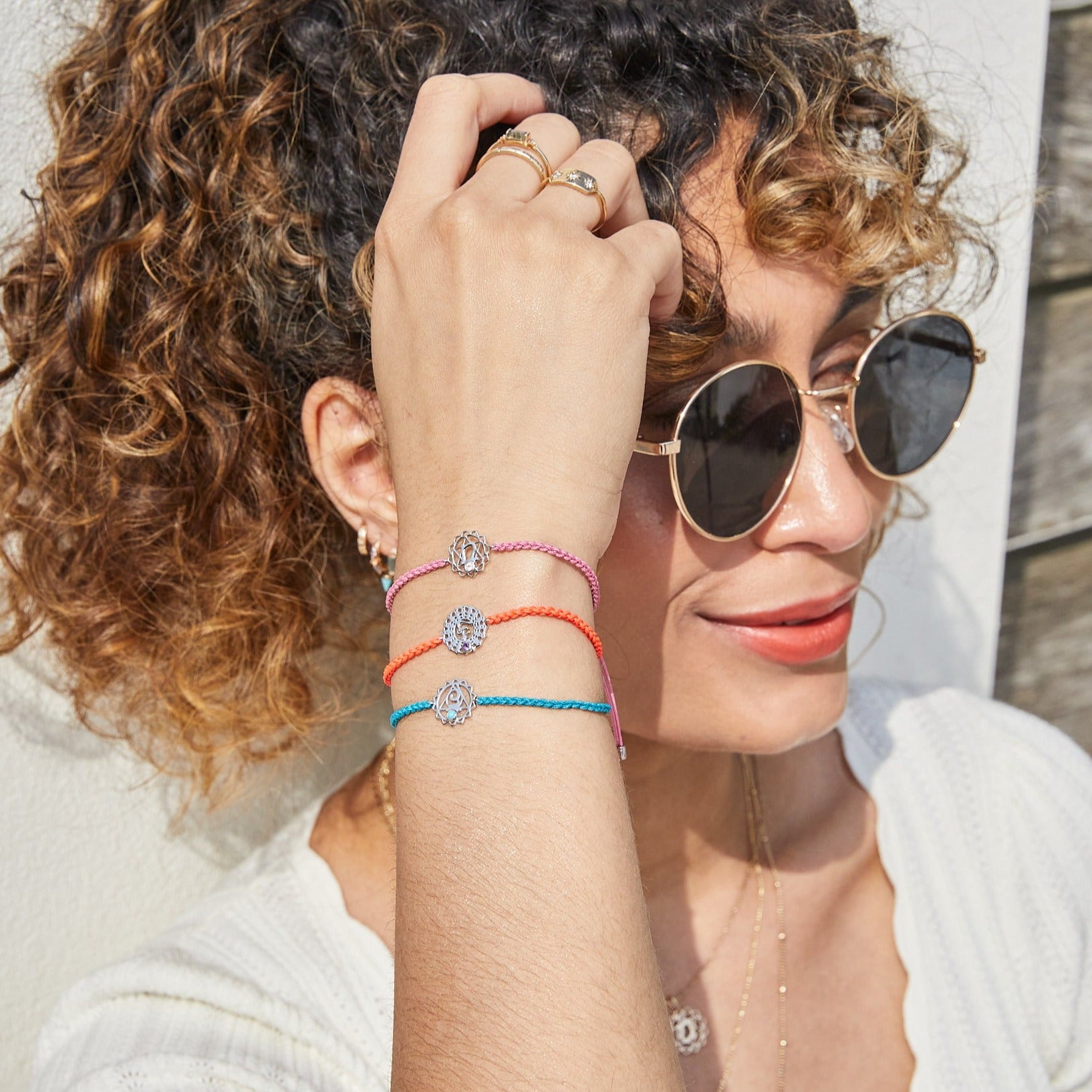 model wearing chakra bracelets including the Crown Chakra Bracelet sterling Silver 