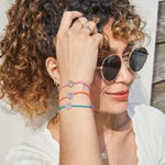 model wearing chakra bracelets including the Heart Chakra Bracelet sterling Silver