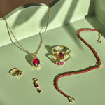 garnet jewellery on green tray