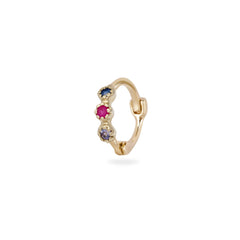 Gold hoop earring with colored gemstones on a white background