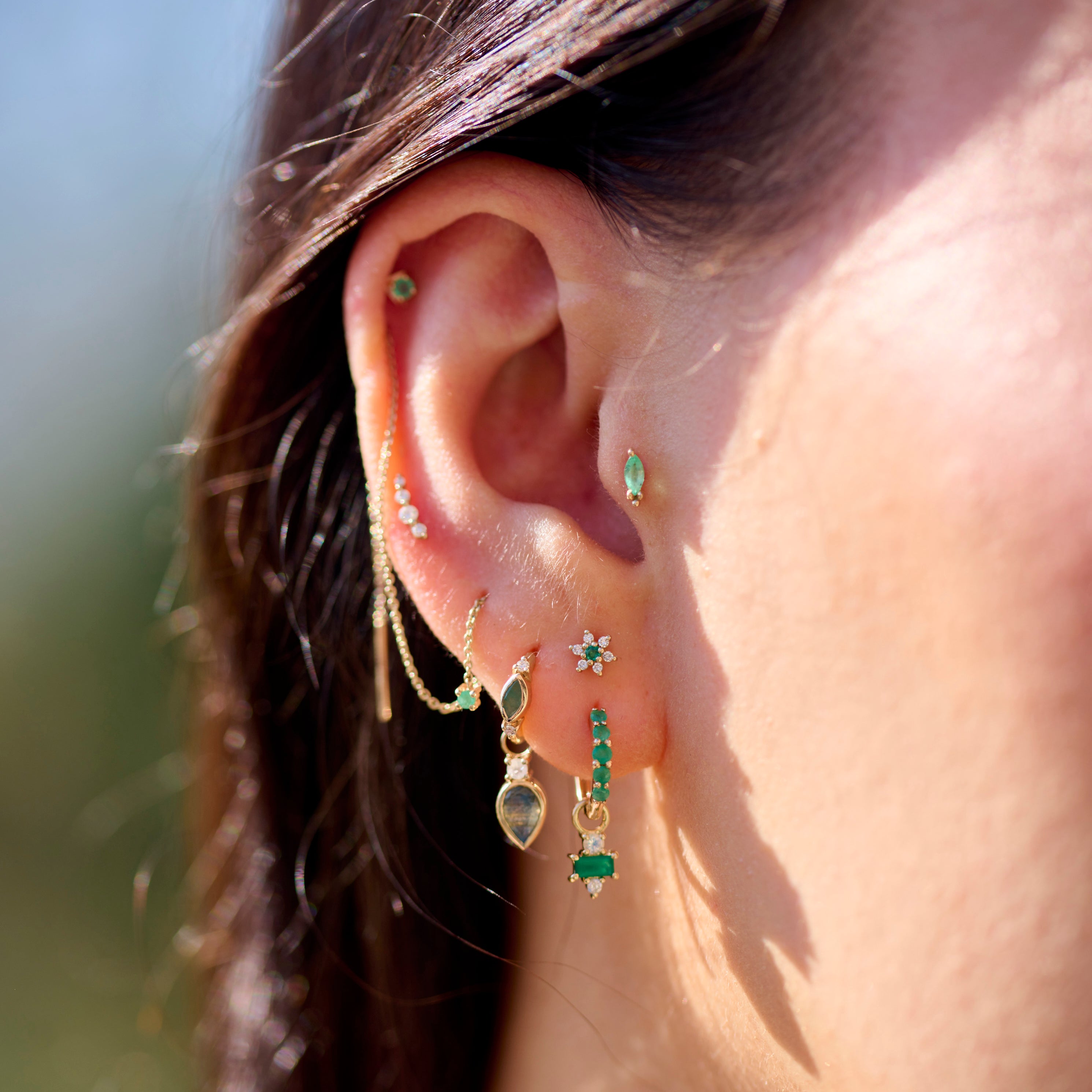 green earring charms on model