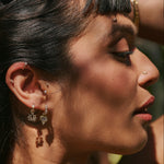 close up of model solid gold earrings including the Labradorite & White Sapphire Earring Charm 9k Gold
