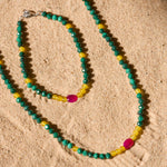 beaded jewellery on sand