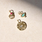 solid gold pendants on stone