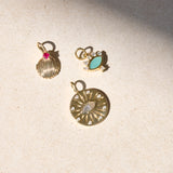 solid gold pendants on stone
