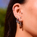 silver charm earrings on Hollie
