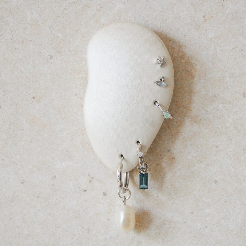 ear stack on stand featuring baroque pearl earring charm