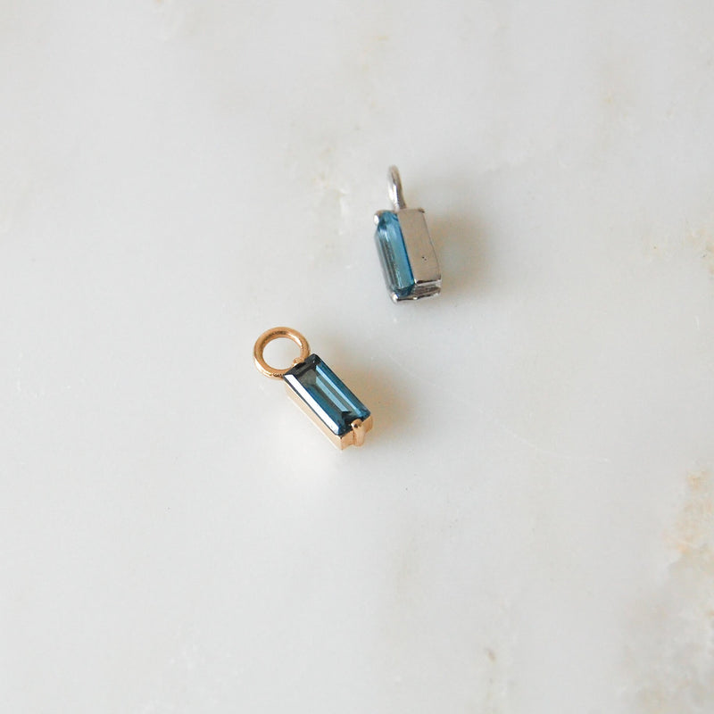 image of gold and silver blue topaz earring charms