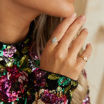 model wearing 2 diamond and solid gold rings including the Diamond Pavé Ring 9k Gold