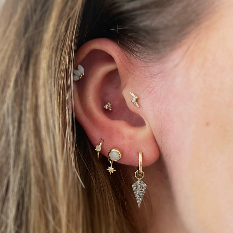 EAR WITH PIERCINGS AND DIAMOND EARRINGS
