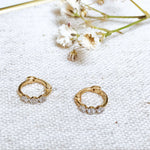 Mini Diamond Trilogy Huggie Hoop Earring pair 9k Gold on fabric 