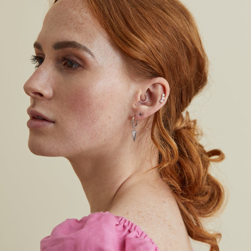 model wearing ear stack with diamond hoop daith earring in sterling silver