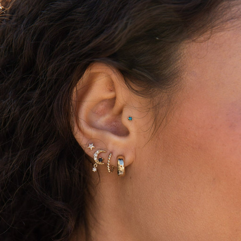 close up of model wearing 5 piece ear stack