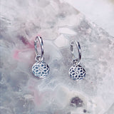 Zohreh Coin Charm Hoop Earrings Sterling Silver on hard surface